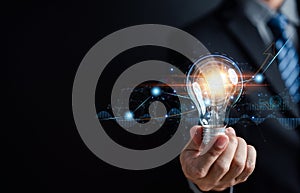 Businessman holding light bulb for business analysis management, Idea and imagination, innovation development leadership, Solution