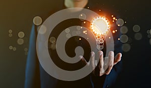 businessman holding a light bulb graphic Digital technology abstract. imagine an idea Creative and innovative. brain to brainstorm