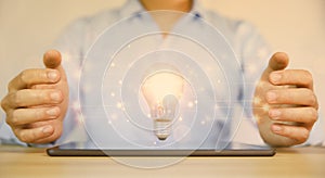 businessman holding a light bulb graphic Digital technology abstract. imagine an idea Creative and innovative. brain to brainstorm