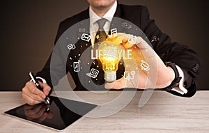 Businessman holding a light bulb, social media concept