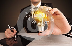 Businessman holding a light bulb, social media concept