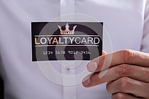 Businessman Holding Loyalty Card