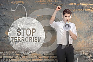 Businessman holding a megaphone with stop terrorism sign