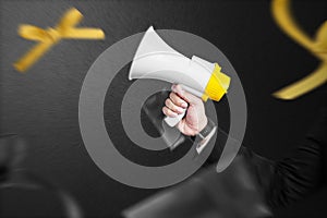 Businessman holding megaphone to announce of Black Friday promotion