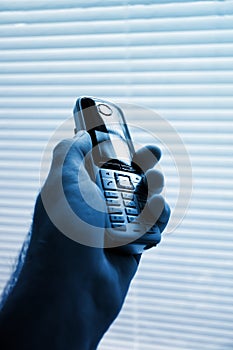 Businessman holding a modern cordless phone