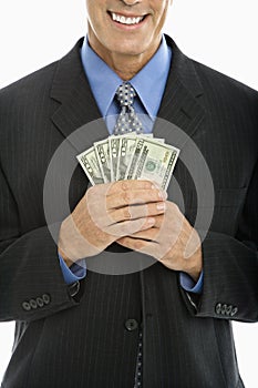 Businessman holding money.