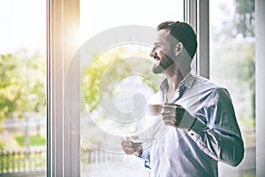 businessman holding morning cup of coffee