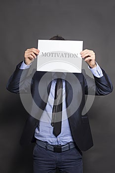 Businessman Holding a motivation Sign