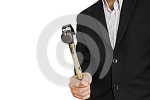 Businessman holding old hammer, isolated on white background