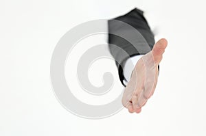 Businessman holding out his hand for a handshake .