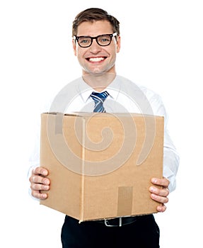 Businessman holding packed carton