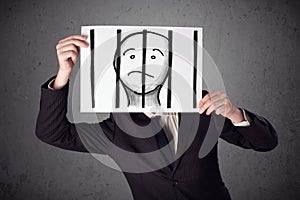 Businessman holding a paper with a prisoner behind the bars on i