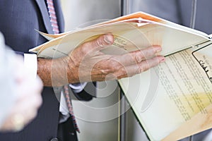 Businessman holding papers