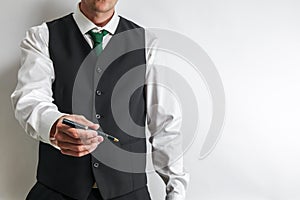 Businessman holding a pen for customer to sign contract.