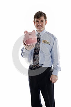 Businessman holding piggy bank