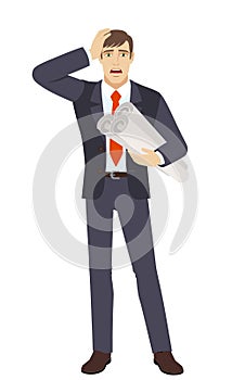 Businessman holding the project plans and grabbed his head