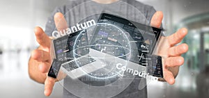 Businessman holding Quantum computing concept with qubit and devices 3d rendering