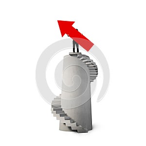 Businessman holding red arrow sign on concrete spiral tower