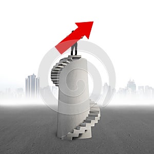 Businessman holding red arrow sign on concrete spiral tower