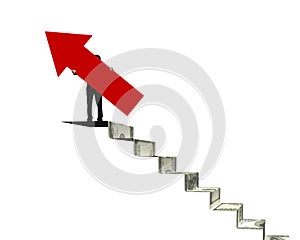 Businessman holding red arrow sign on money stairs