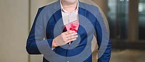 Businessman holding the red gift box