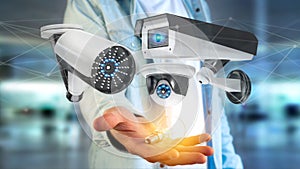 Businessman holding a Security camera system and network connect