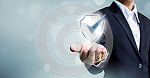 Businessman holding shield protect icon, Concept cyber security
