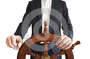 Businessman holding ship rudder isolated on white.