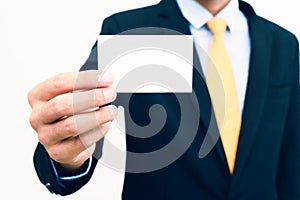 Businessman holding and showing blank business card isolate on white background