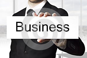 Businessman holding sign business