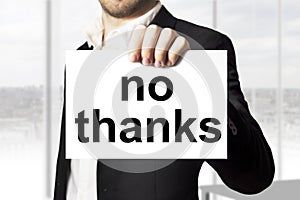 Businessman holding sign no thanks