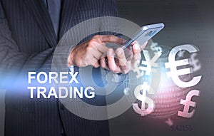 Businessman holding smart phone world of currency forex trading photo