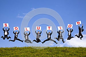 Businessman holding solution text