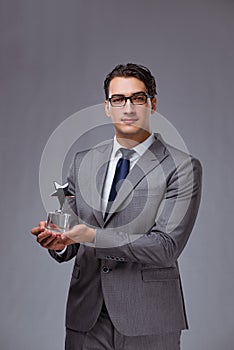 The businessman holding star award in business concept