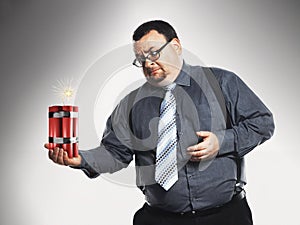 Businessman Holding Sticks Of Dynamite