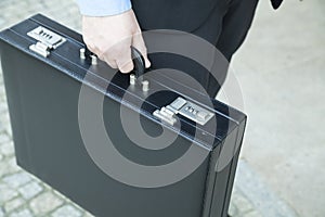 Businessman holding a suitcase