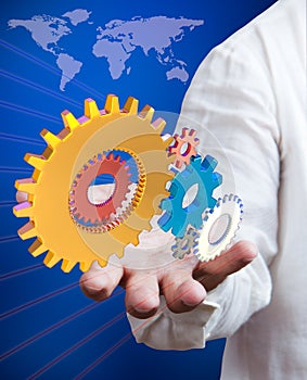 Businessman holding synergy gears