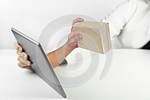 Businessman holding a tablet with hand holding paper box give gift