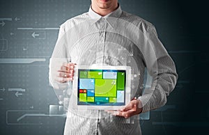 Businessman holding a tablet with modern software operational sy