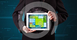 Businessman holding a tablet with modern software operational system