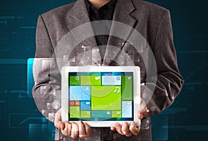 Businessman holding a tablet with modern software operational system