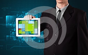 Businessman holding a tablet with modern software operational system