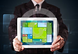 Businessman holding a tablet with modern software operational system