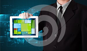 Businessman holding a tablet with modern software operational system