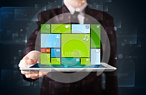 Businessman holding a tablet with modern software operational system