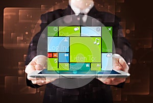 Businessman holding a tablet with modern software operational system