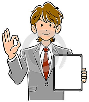 Businessman holding a tablet PC with a blank screen and giving an OK sign