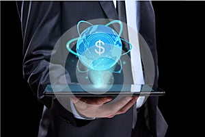 Businessman holding tablet with a projected on-screen icon online trading dollar. business Internet concept.
