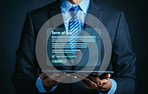 Businessman holding tablet of Terms of use concept, reading terms and conditions of website or service before clicking button