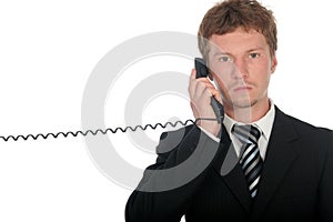 Businessman holding a telephone handset